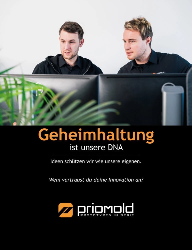 priomold Unternehmenswert Geheimhaltung: Zwei Mitarbeiter am Arbeitsplatz als Symbol für vertrauliche Projekte, Innovation und Schutz von Kundendaten.